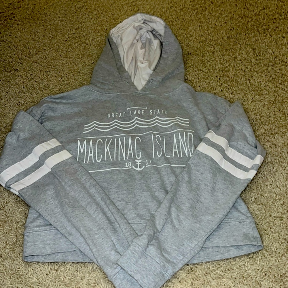It’s a medium cropped hoodie in grey from Mackinac Island